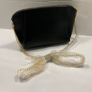 Small black handbag with goldtone chain strap.  NEW